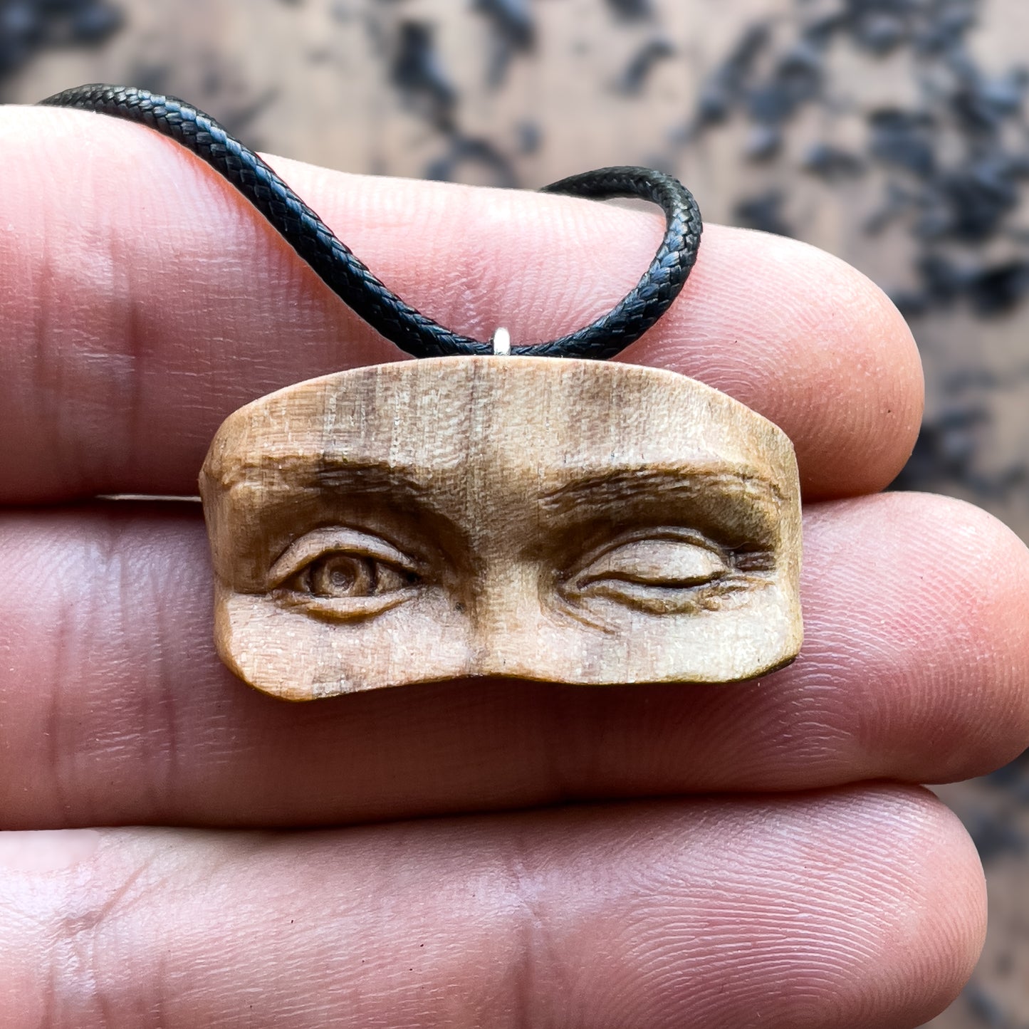 Winking Eyes Walnut Wood Pendant