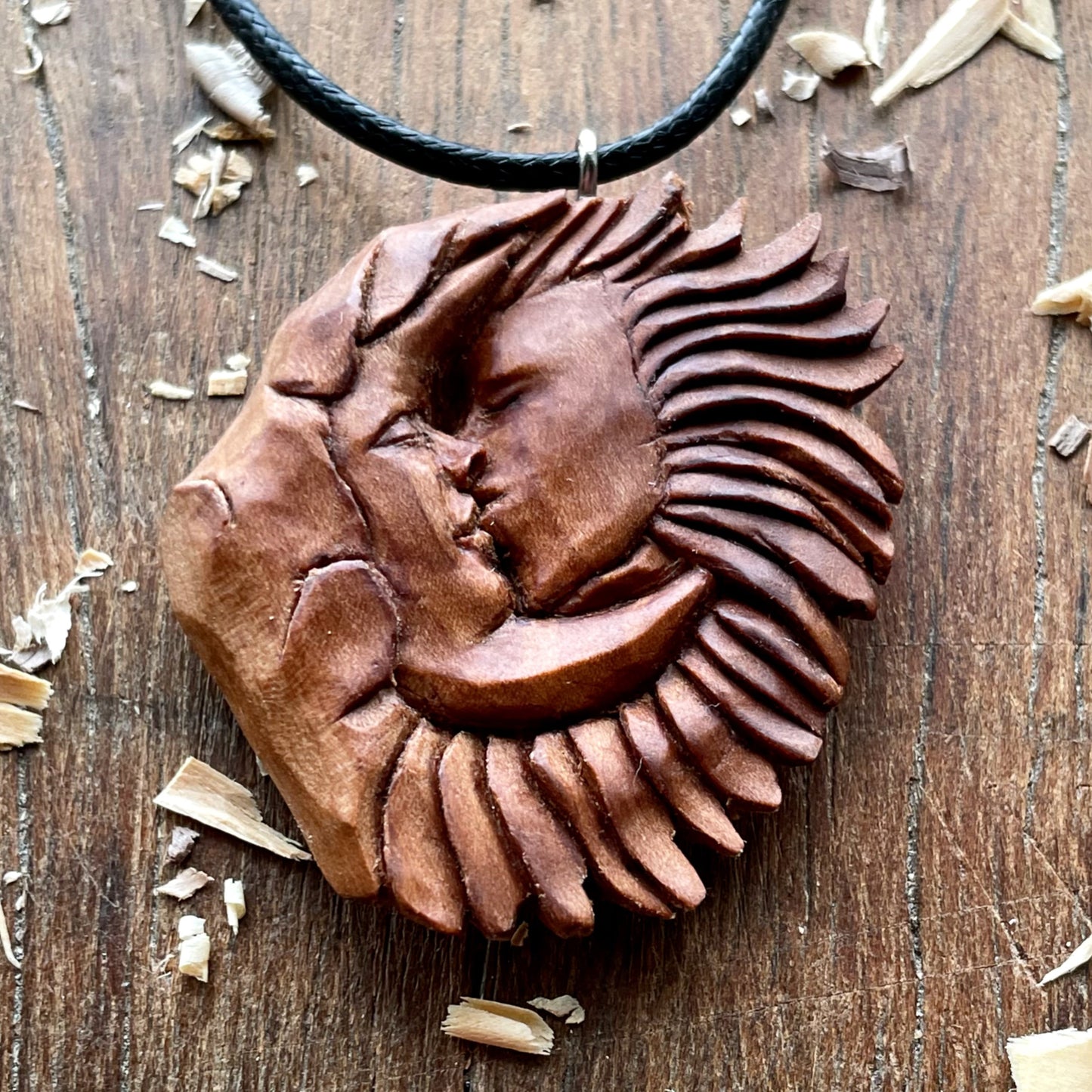 “Sun and Moon Kiss” Apricot Wood Pendant