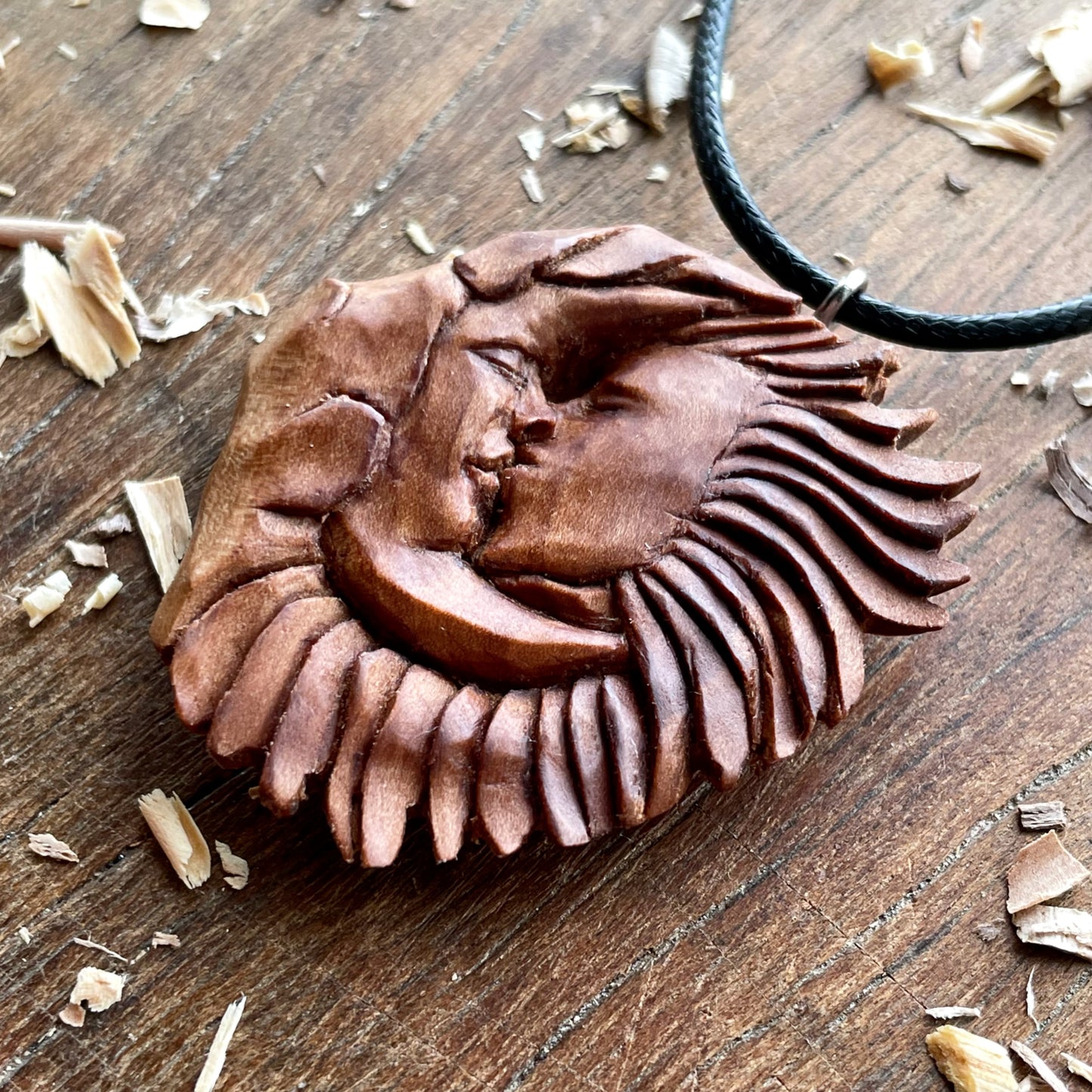 “Sun and Moon Kiss” Apricot Wood Pendant