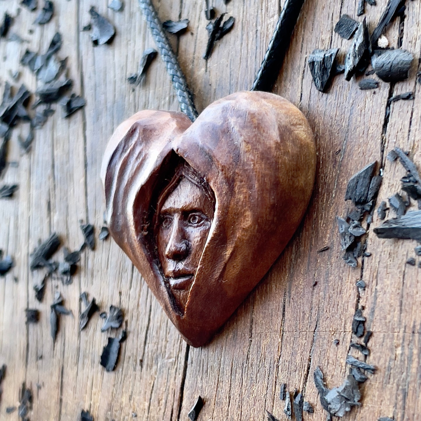 Face Into Heart Plum Wood Pendant