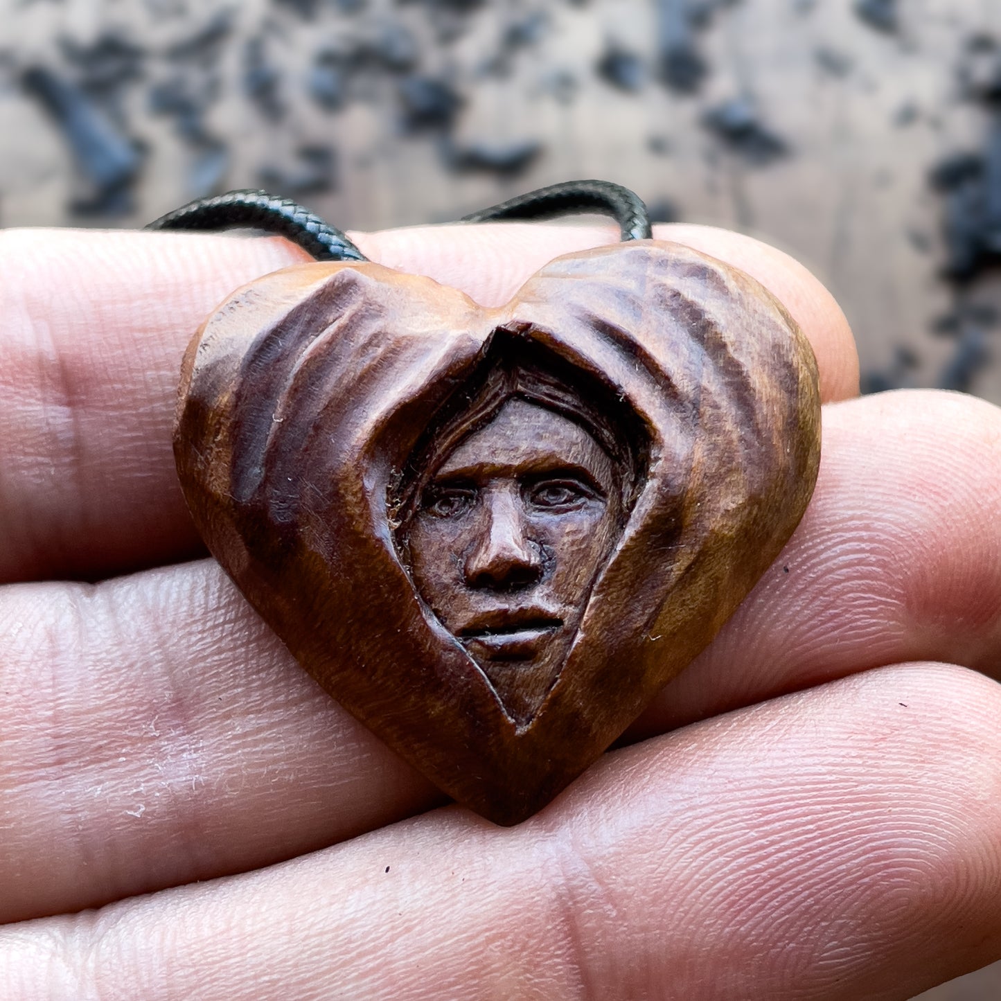 Face Into Heart Plum Wood Pendant