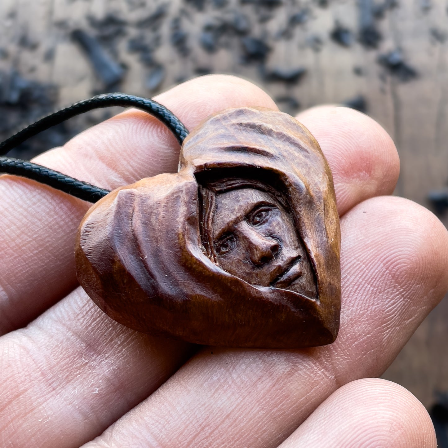 Face Into Heart Plum Wood Pendant