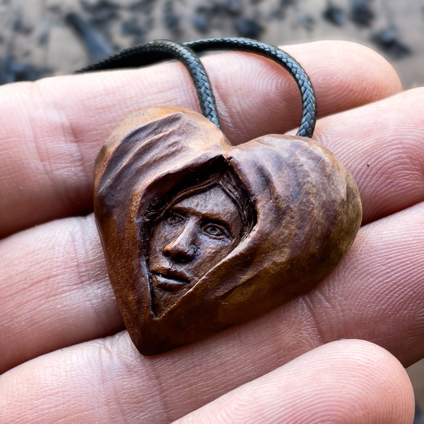 Face Into Heart Plum Wood Pendant