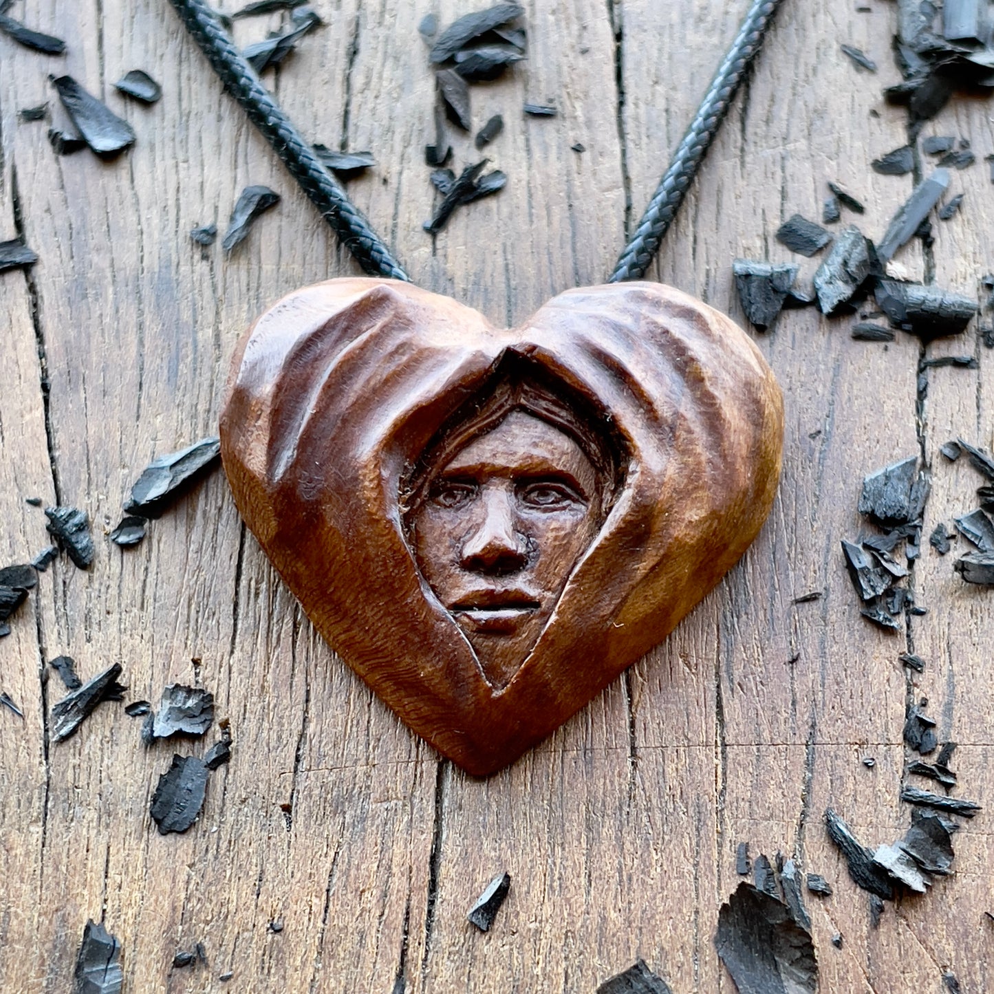 Face Into Heart Plum Wood Pendant