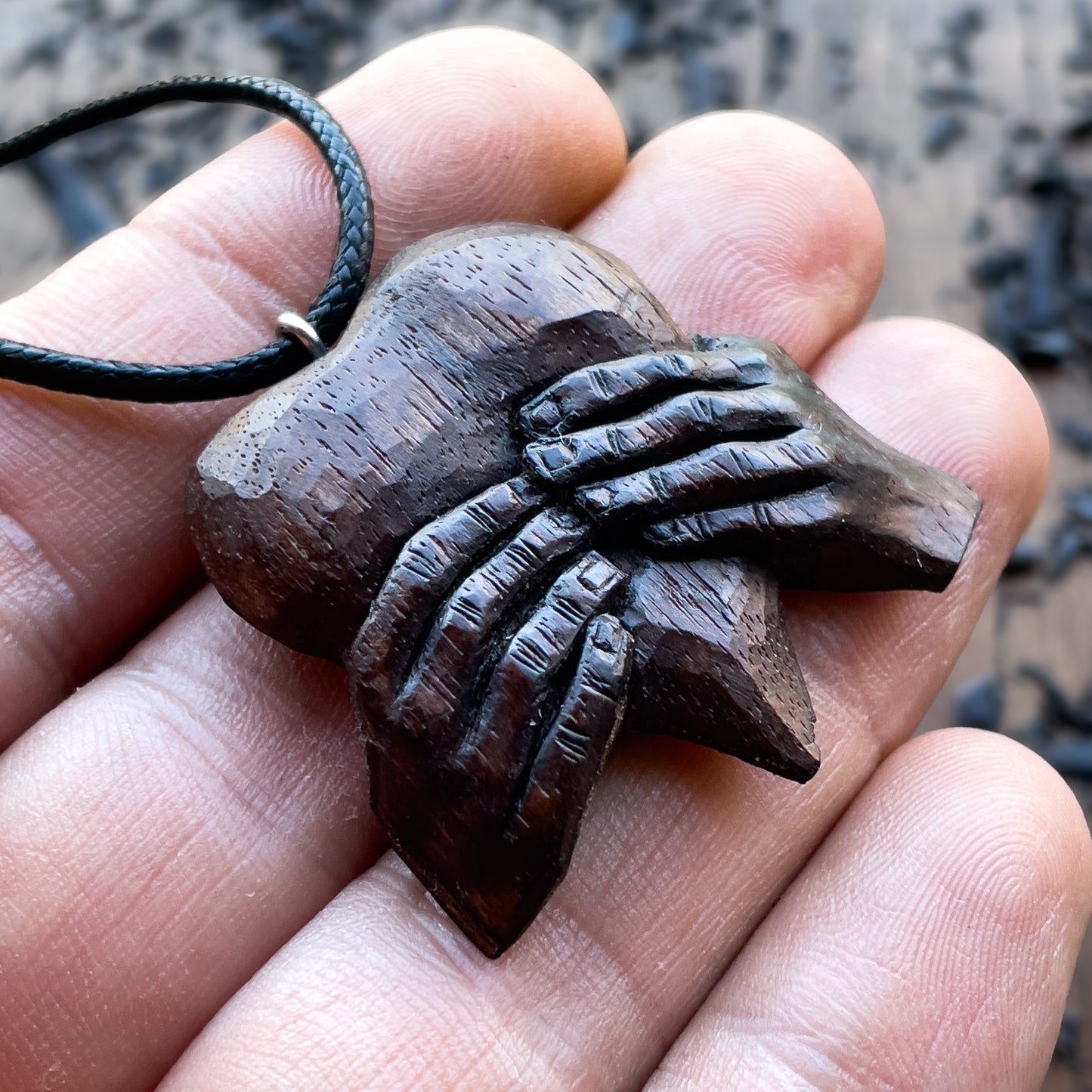 “Hands Squeezing Heart” Walnut Wood Pendant