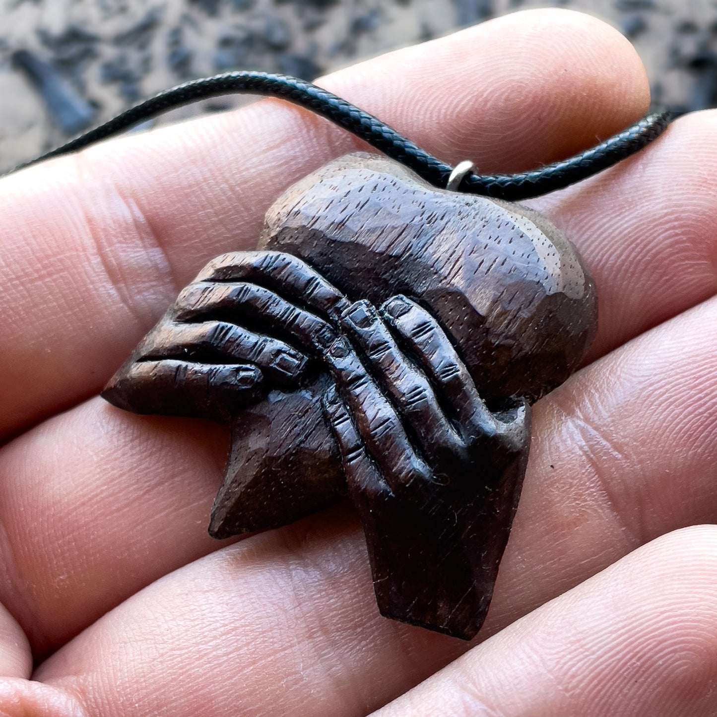 “Hands Squeezing Heart” Walnut Wood Pendant