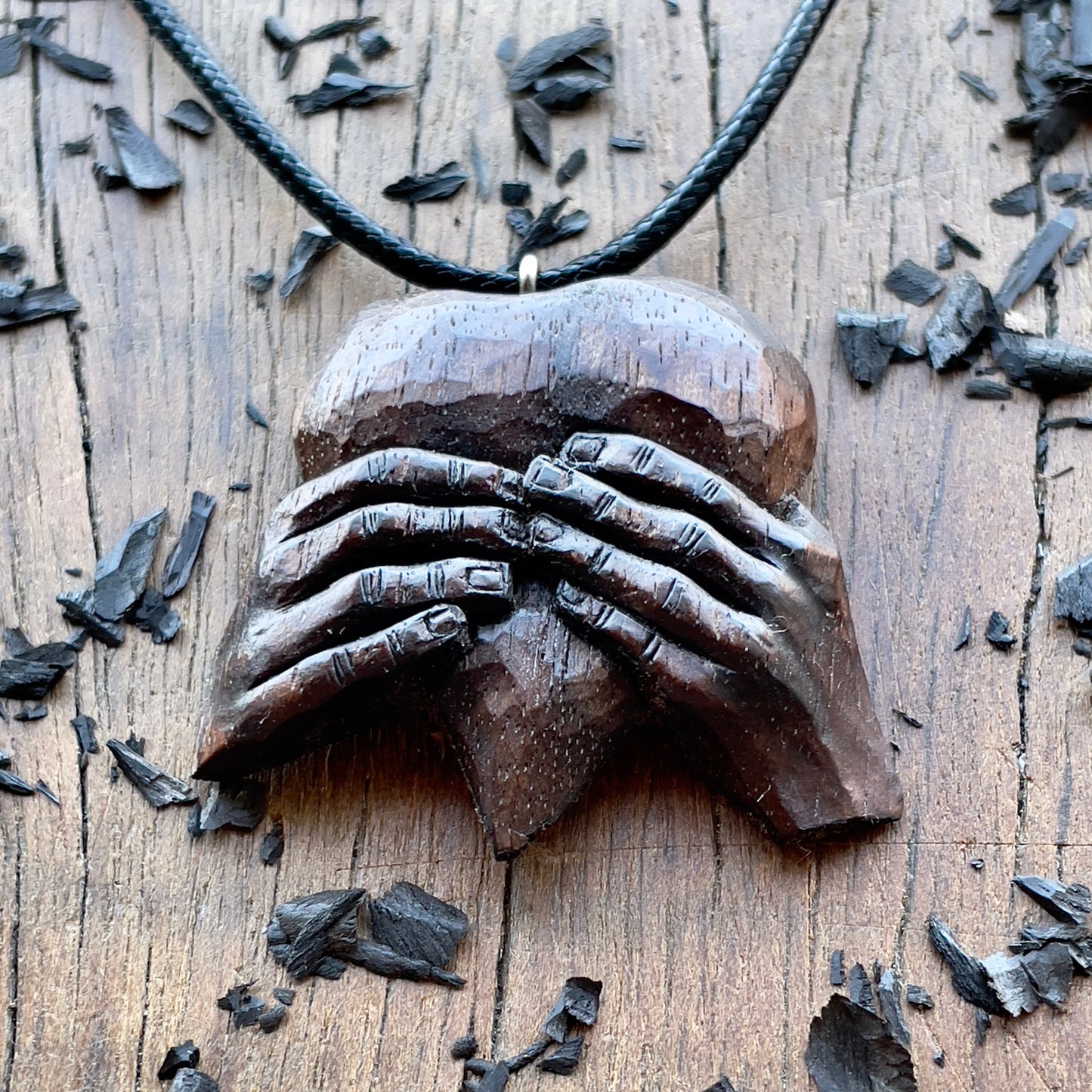 “Hands Squeezing Heart” Walnut Wood Pendant