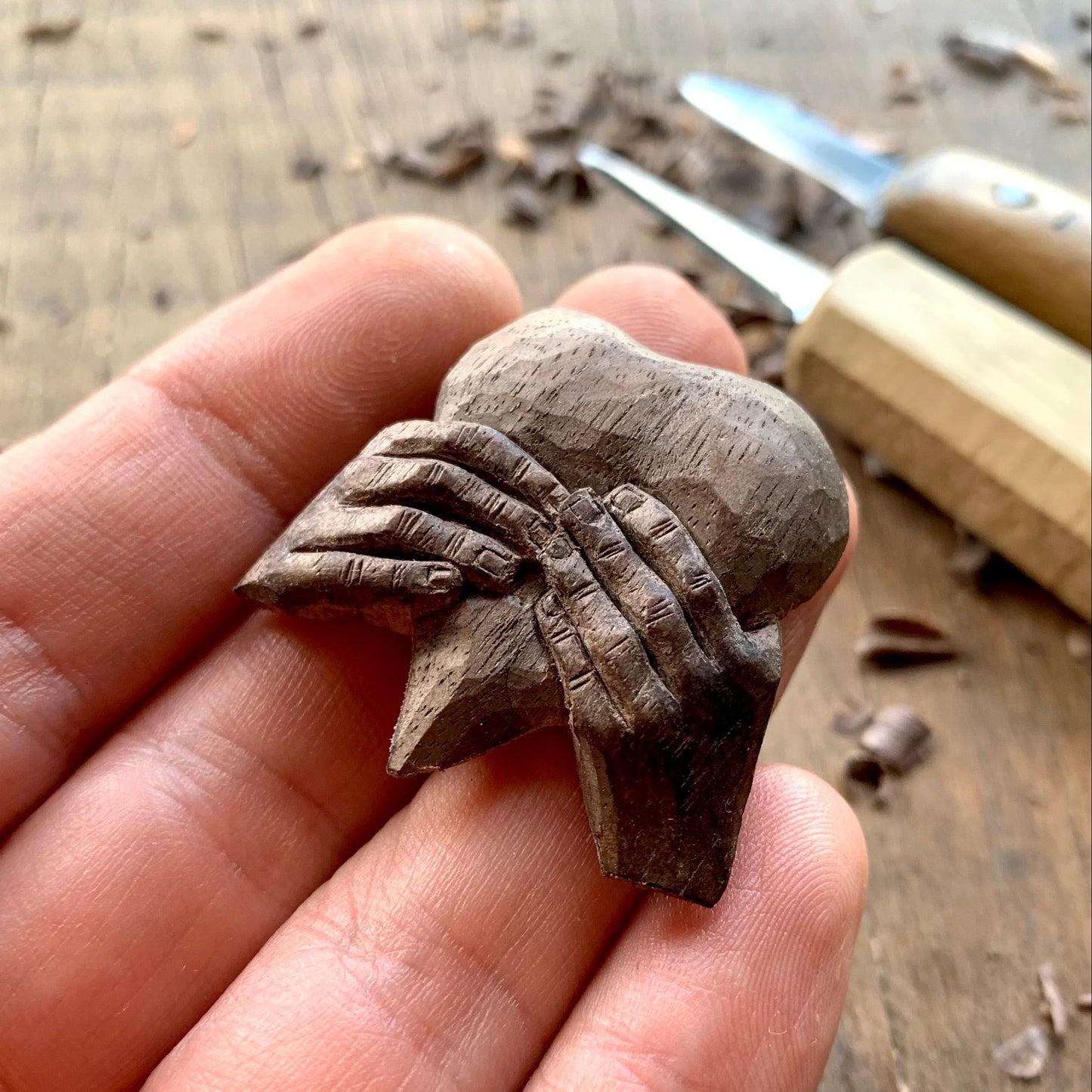 “Hands Squeezing Heart” Walnut Wood Pendant
