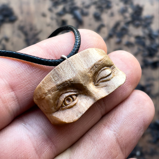 Winking Eyes Walnut Wood Pendant