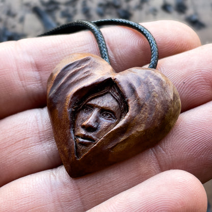 Face Into Heart Plum Wood Pendant