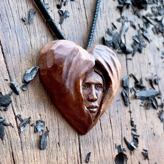 Face Into Heart Plum Wood Pendant