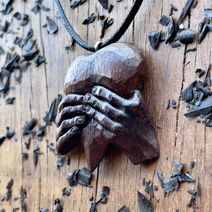 “Hands Squeezing Heart” Walnut Wood Pendant