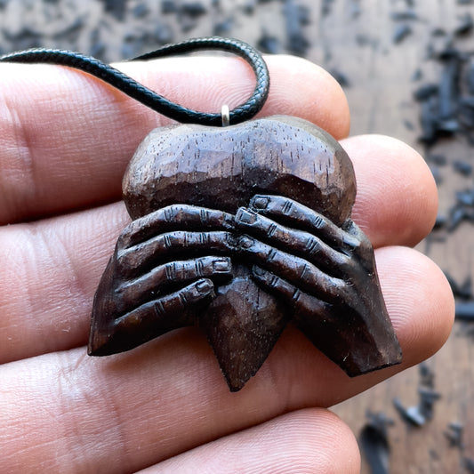 “Hands Squeezing Heart” Walnut Wood Pendant