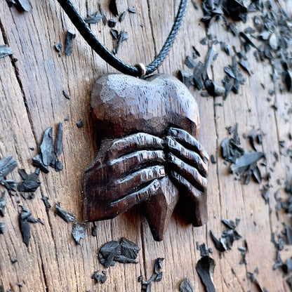 “Hands Squeezing Heart” Walnut Wood Pendant
