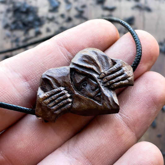 Hands Opening Heart With Face Pendant