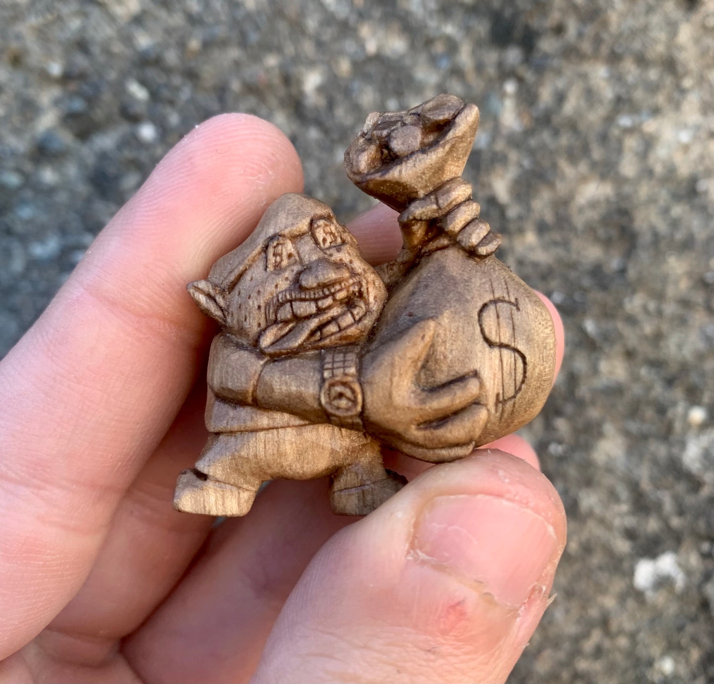 Man with a bag of coins pendant