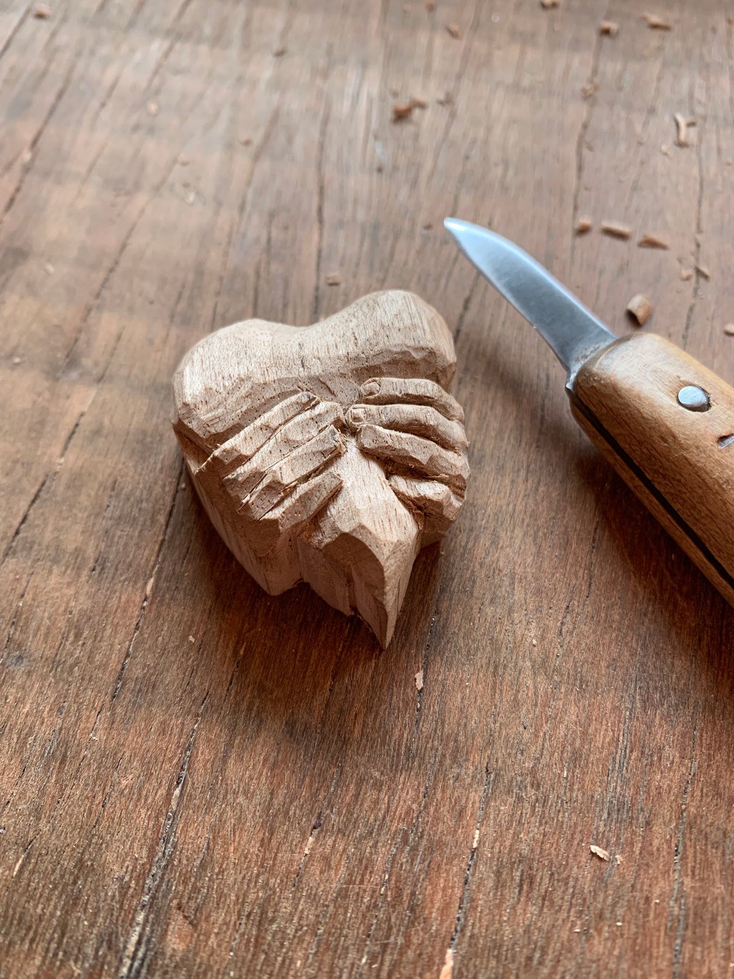 “Hands squeezing a Heart” Pendant