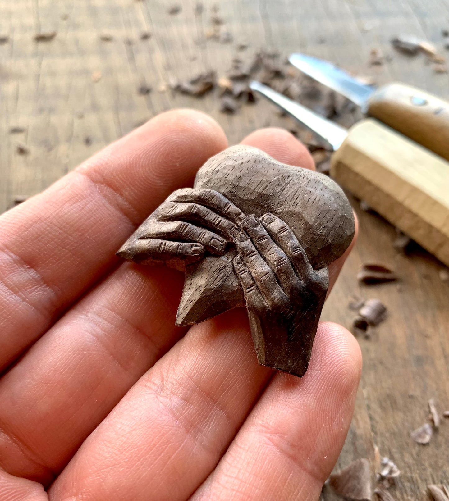 “Hands Squeezing Heart” Walnut Wood Pendant