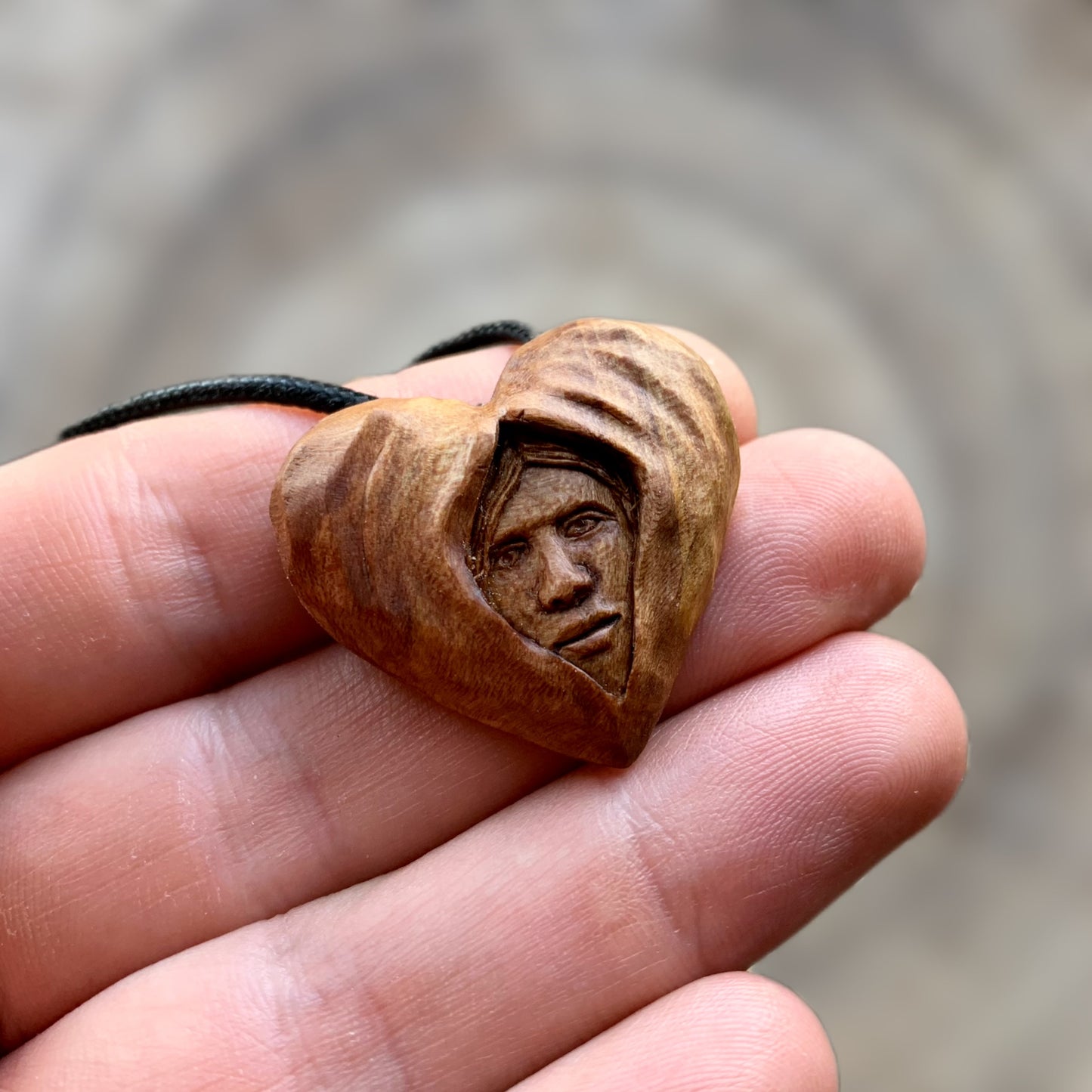 Face Into Heart Plum Wood Pendant