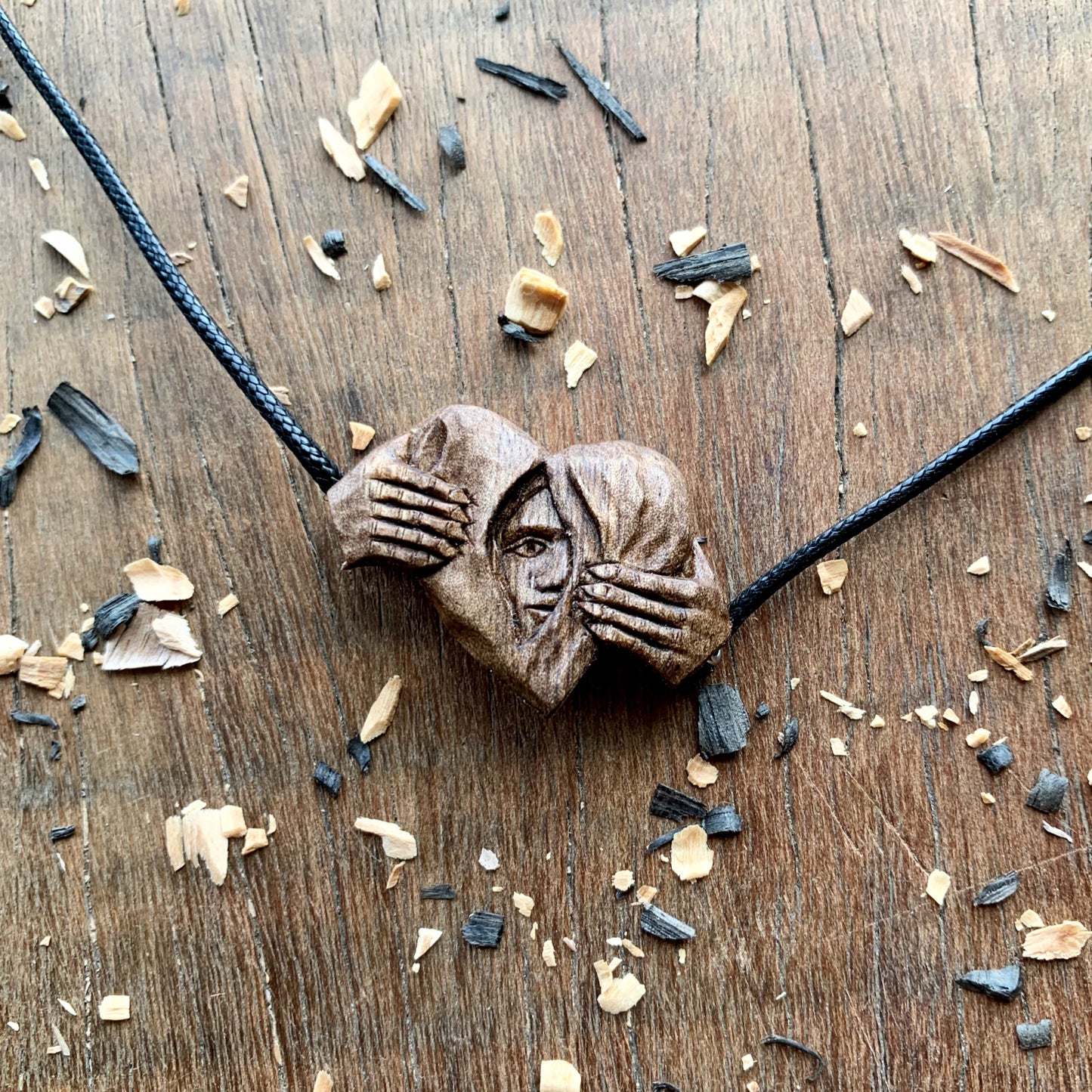 Hands Opening Heart With Face Pendant