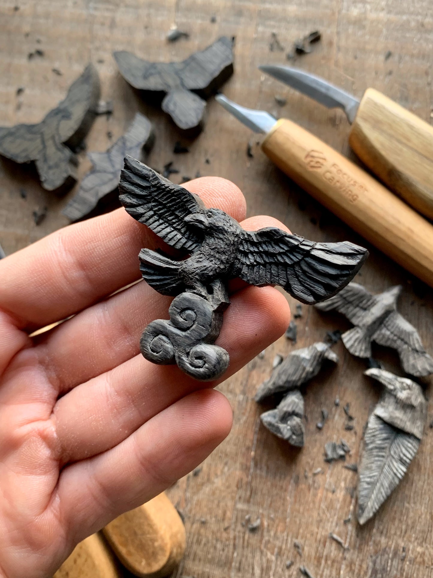 Flying Raven Holding Triskelion Pendant