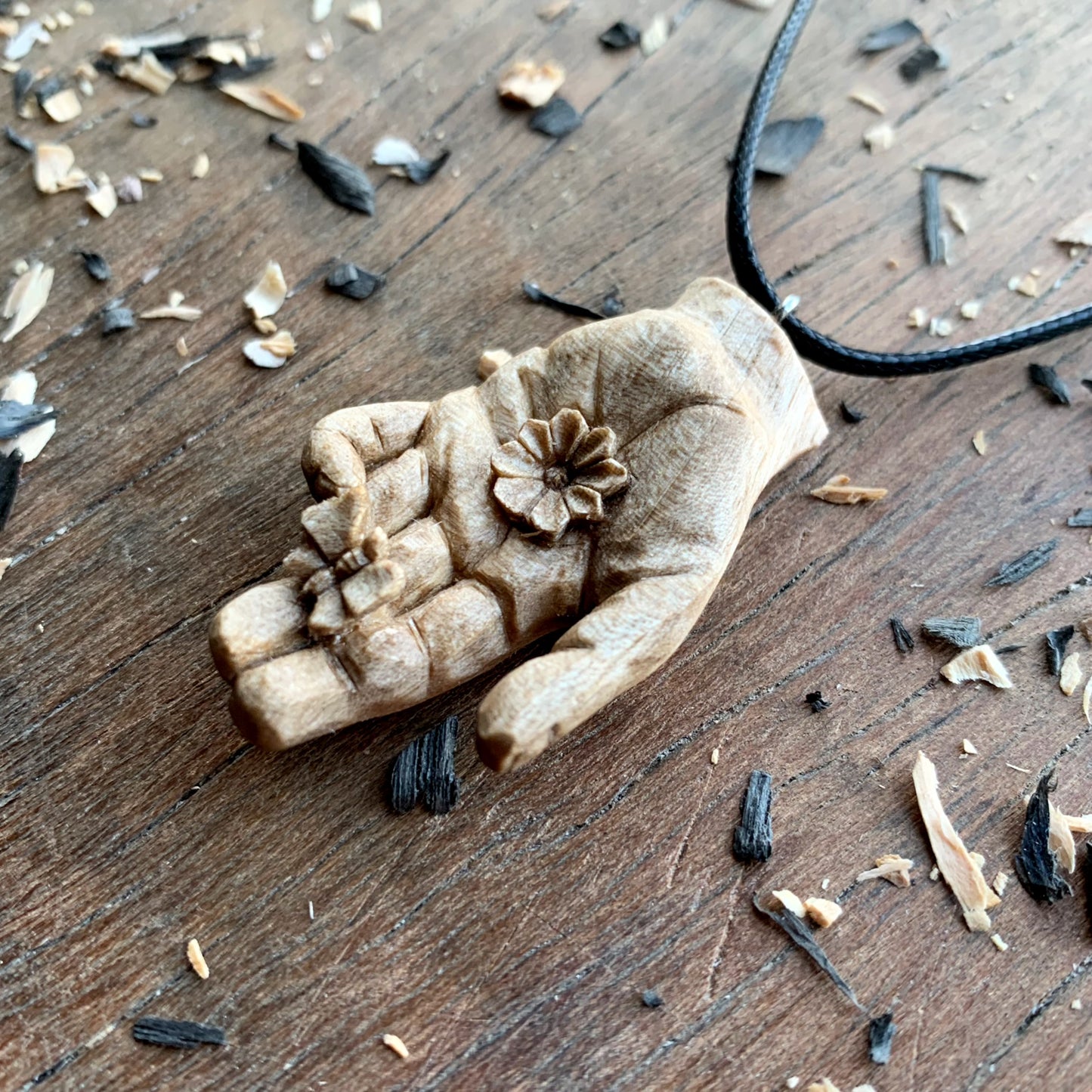 Hand With Butterfly and Flower Pendant