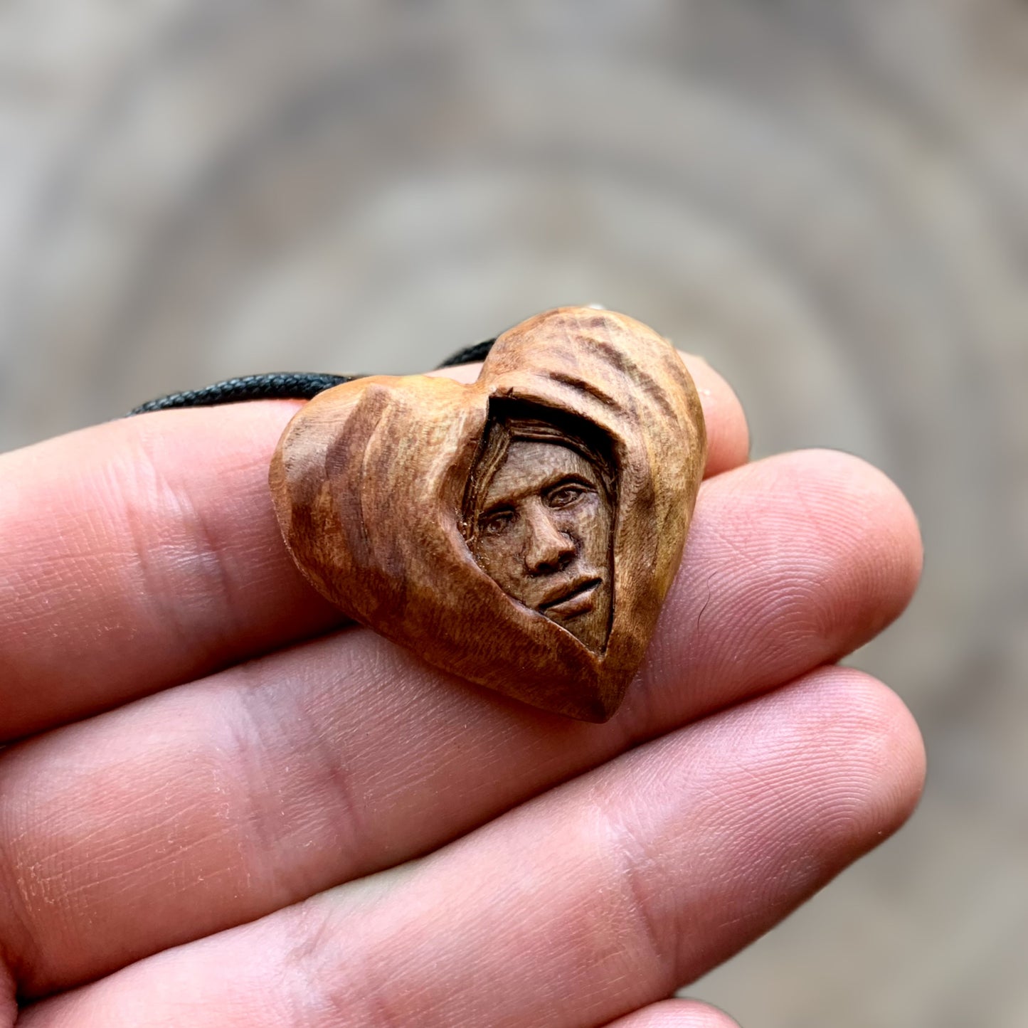 Face Into Heart Plum Wood Pendant