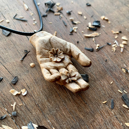 Hand With Butterfly and Flower Pendant