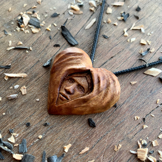 Face Into Heart Plum Wood Pendant