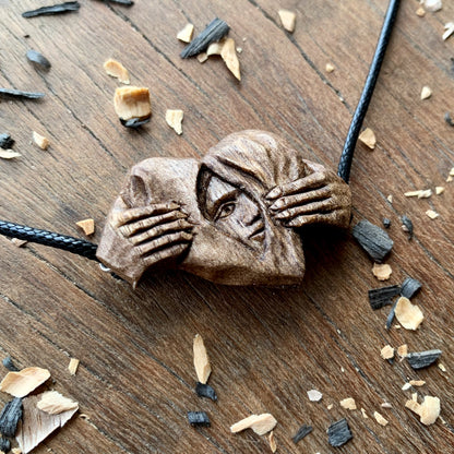 Hands Opening Heart With Face Pendant