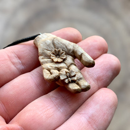 Hand With Butterfly and Flower Pendant