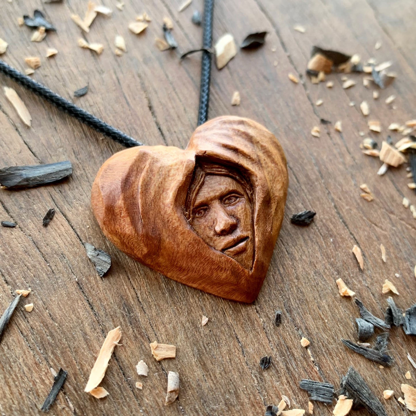 Face Into Heart Plum Wood Pendant