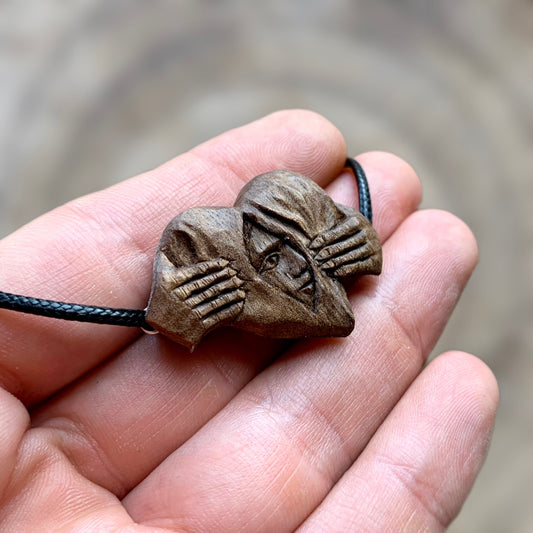 Hands Opening Heart With Face Pendant
