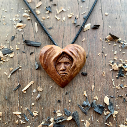 Face Into Heart Plum Wood Pendant