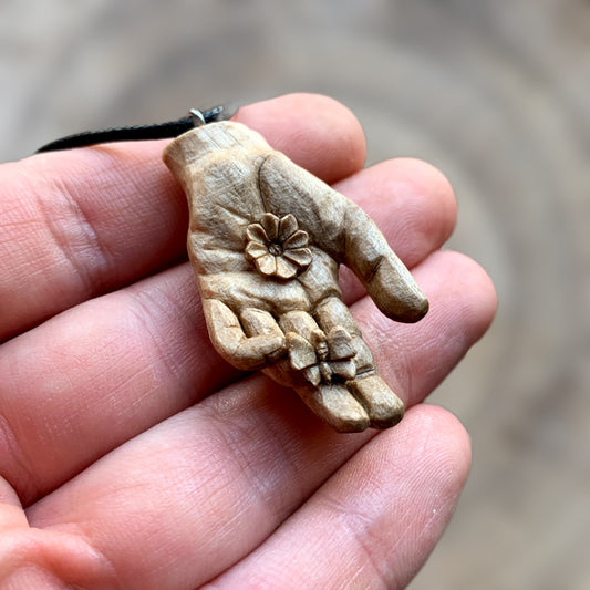 Hand With Butterfly and Flower Pendant