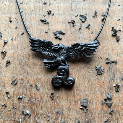 Flying Raven Holding Triskelion Pendant