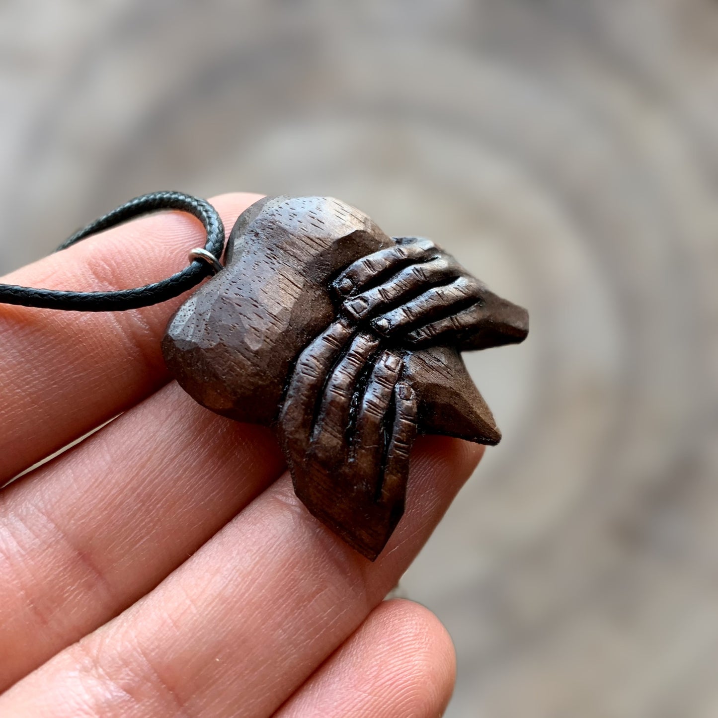 “Hands Squeezing Heart” Walnut Wood Pendant