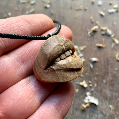 Biting Lips Walnut Wood Pendant