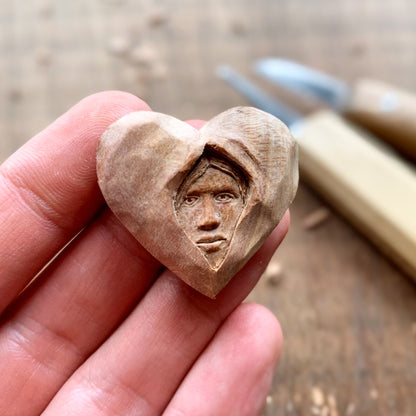 Face Into Heart Plum Wood Pendant