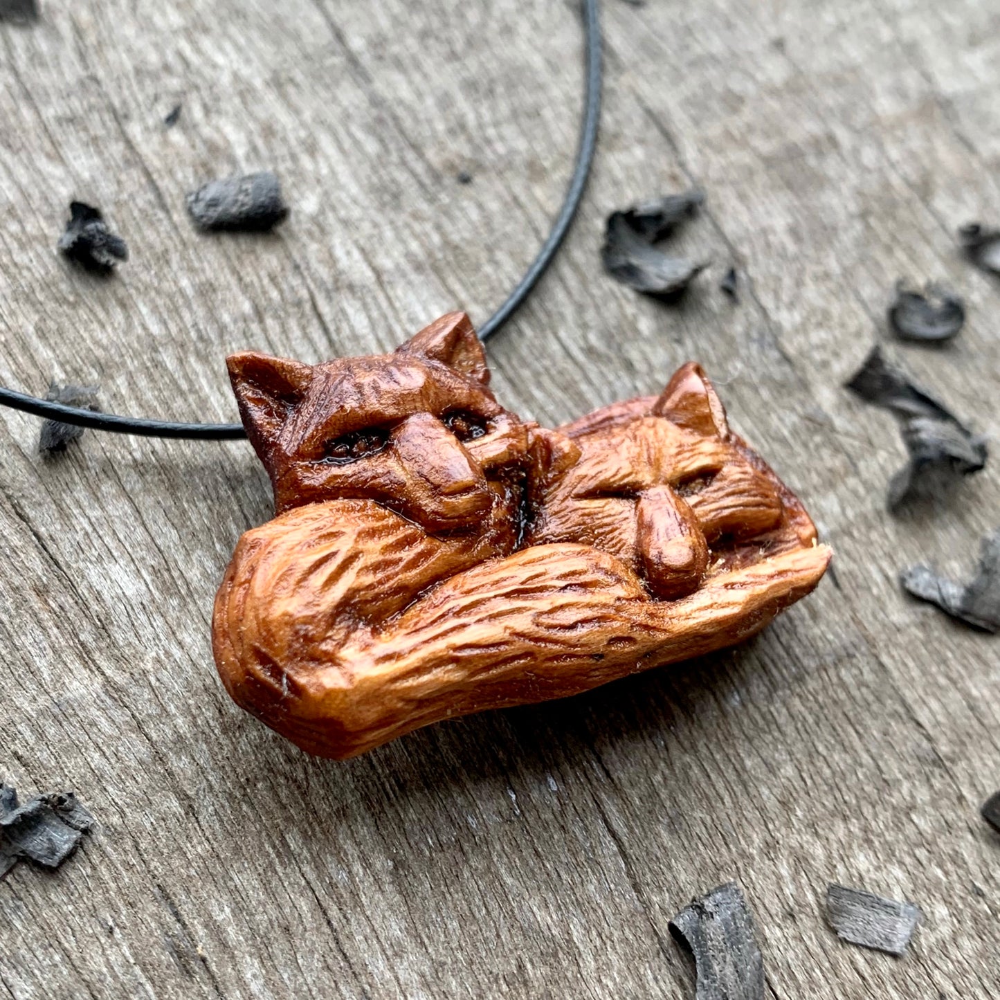 Two Lying Foxes Pendant, Plum Wood Necklace